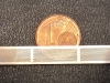 Laserbohren - Cent mit Lochstreifen